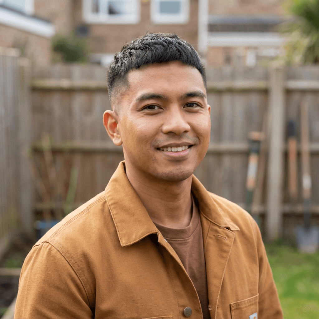 Marcus T. smiling while holding a delivery bag